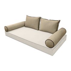 a white couch with two pillows on it