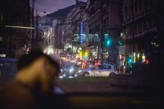 a city street filled with lots of traffic at night