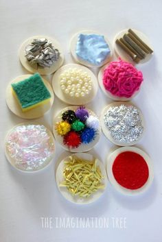 several different types of crafting supplies on a white surface