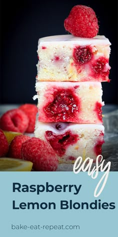 raspberry lemon blondies stacked on top of each other with fresh raspberries