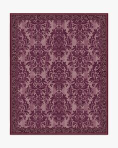 a purple rug with an ornate design on it