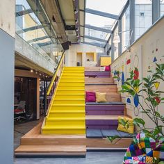 the stairs are painted bright yellow and purple