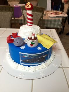 there is a cake that looks like it has been made to look like the lighthouse