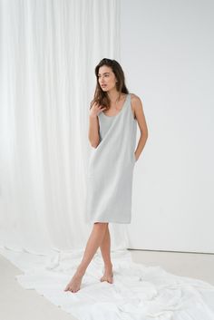 "Loose UMA sleeveless dress in ice grey. - length is ± 105 cm (41.3\") (depends on size) - with pockets - straight cut - loose fit NOTE: This dress is oversized, please have this in mind when choosing your size. DETAILS: - 100 % European, pre-washed medium weight linen (205 g/m²) - the model is 180 cm (5′11″) high, wearing size S. - model measurements: bust 84 cm (33\") / waist 61 cm (24\") / hips 92 cm (36\") - color in the picture - ice grey (you can choose other color on the right) MADE TO OR Midi Linen Dress, Linen Summer Dress, Resort Dress, Linen Summer, Western Outfits Women, Summer Linen Dresses, Resort Dresses, Tank Top Dress, Grey Tank Top