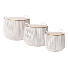 three white wicker baskets with handles