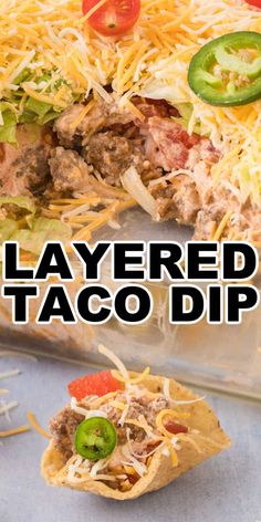 layered taco dip with cheese, tomatoes and jalapenos on the side