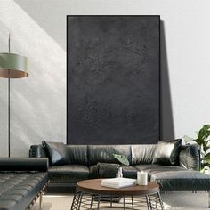 a living room filled with furniture and a painting on the wall