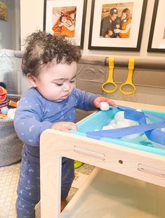 a young child playing with an ice tray