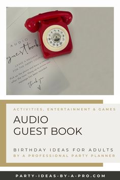 an old fashioned red phone sitting on top of a piece of paper with the words audio guest book written below it