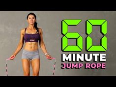 a woman standing in front of a wall with the number 55 minute jump rope