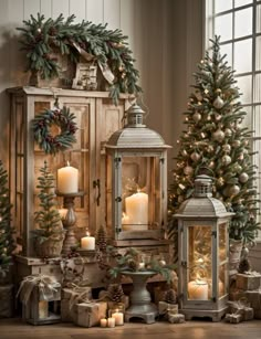 christmas decorations with lit candles and pine cones