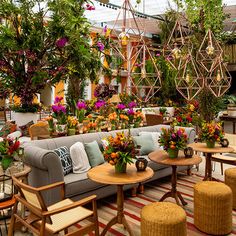 a room filled with lots of furniture and flowers on top of it's walls