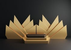 an abstract golden sculpture is shown against a black background with light coming from the top