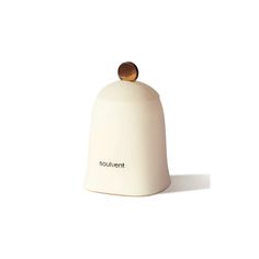 a white bell shaped object with a wooden knob on top and the word soulvantt written below it