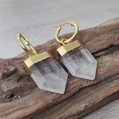 Transform Your Energy with Clear Quartz Earrings Discover the profound healing properties of our Gold Plated Carved Shield Shape Clear Quartz Earrings. Each pair is meticulously crafted to enhance your spiritual journey and promote personal growth. Unleash the Power of Clear Quartz Clear Quartz is known as the "Master Healer," resonating with pure white light that connects you to the Divine Mind. This extraordinary stone is the key to activating the eighth chakra, fostering a deep connection wit Earrings Golden, Healing Crystal Jewelry, Porcelain Jewelry, Natural Stone Jewelry, Quartz Jewelry, Deep Connection, Quartz Earrings, Jewelry Wholesale, White Crystal