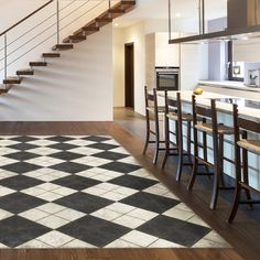 a kitchen with a checkered floor and stairs