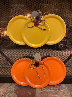 three orange plates sitting on top of each other