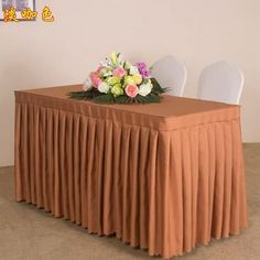 there is a table with flowers on it