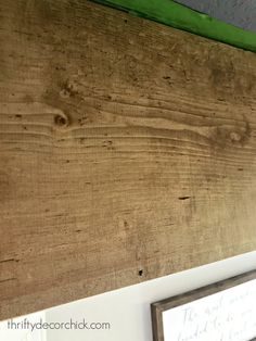 a close up of a wooden board on the wall