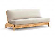 a white couch sitting on top of a wooden frame