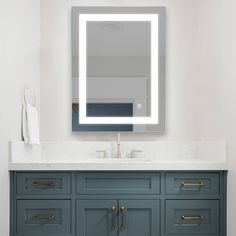 a bathroom vanity with a large mirror above it