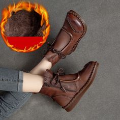 a woman's feet wearing brown shoes with flames in the background