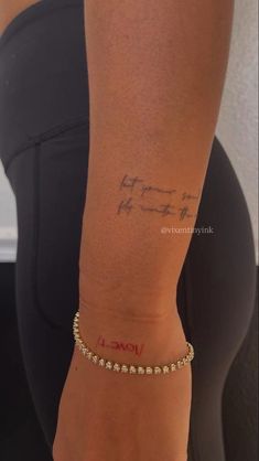 a woman's arm with writing on it