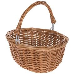 a brown wicker basket with handles on a white background