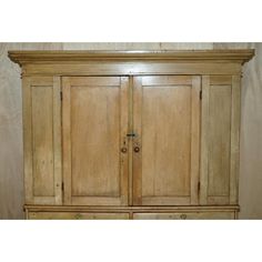 an old wooden armoire with two doors