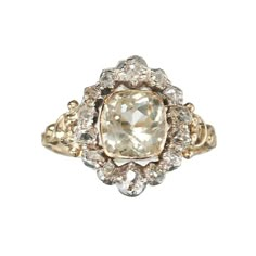 A French antique, Louis Philippe I period, cluster ring, in the Georgian style, set with a cushion cut, pale yellow, citrine, in a gold rub over setting, with an old mine-cut diamond surround, in silver, cut down, closed back settings, on a decorative gold shank, with carved shoulders, with a French eagle head mark, for 18ct gold, circa 1840. Period: Circa 1840 Style: Georgian Metal: Silver and gold Stone: Citrine and diamond Finger Size: L ½ UK / 5 7/8 US Country Of Origin: France Condition: Go Luxury Heirloom Gold-plated Ring, Luxury Heirloom Rings In Recycled Gold, Luxury Yellow Gold Heirloom Cluster Ring, Luxury Gold Heirloom Diamond Ring, Luxury Heirloom Ring With High Luster, Luxury Heirloom Yellow Gold Cluster Ring, Luxury Antique Yellow Gold Rings, Luxury Heirloom Diamond Ring In Recycled Gold, Luxury Yellow Gold Heirloom Rings