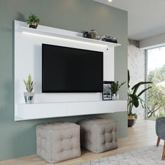 a flat screen tv mounted to the side of a wall