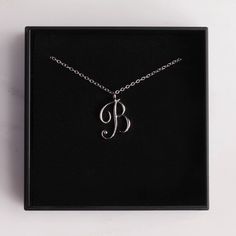 Letter B Initial Necklace - Cursive "B" initial silver pendant - Personalized initial silver pendant for women / Gift for her / for mom Dainty "B" initial. Perfect every day necklace. Lovely gift for your self, sister, bridesmaids, new mom. Pendant: Base metal is brass and silver plated on top. Chain is 18 inches, sterling silver. Note: model shots might show a different initial, only to illustrate overall look and length of the chain. This listing is for the "B" initial. B Cursive, B Initial Necklace, Cursive B, Every Day Necklace, Personalized Initial Ring, B Initial, Mom Pendant, Initial Necklace Silver, Writing Gifts