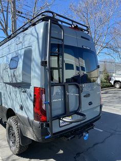 the back end of a vehicle with a camper attached to it