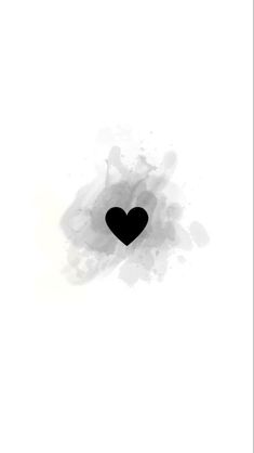 a black heart on a white background with watercolor stains in the shape of a circle