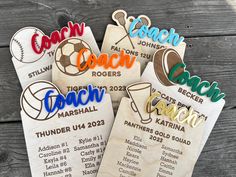 four wooden coach magnets with the names of each team