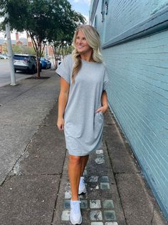 Achieve effortless style with the Always Carefree Dress! This playful t-shirt dress features short sleeves, functional pockets, AND a round neck line for a classic, comfy look. So don't worry, be happy and hop into this easy-breezy garment for some serious chill-vibes (and style)! Loose and slightly oversized fit. Perfect for game day! Model has on a small and is 5'1. Don't Worry Be Happy, Chill Vibes, Tee Shirt Dress, Easy Breezy, Be Happy, Game Day, T Shirt Dress, Don't Worry, Effortless Style