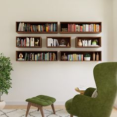 a green chair sitting in front of a book shelf filled with books