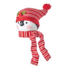 a stuffed animal wearing a red and white striped hat with pom - pom