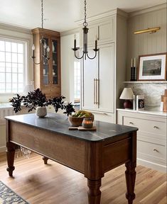 a large kitchen island with two vases on it