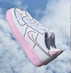 "Authentic Nike Air Force 1 Low (White/Pink) customized with PREMIUM CUT GLASS CRYSTALS. You may select any crystal color on the color chart. Crystal Color in the video is called 'Crystal Moonlight', it is a clear crystal that reflects blue. You may also choose triple black Air Force 1s instead of white (please include this in your personalization if so). You will need to know your US shoe size - https://www.nike.com/size-fit/mens-footwear Shoe Size Conversions- 6.5M (Men's)/8W (Women's) Don't s White Air Force Ones, Pink Nike Air, Bold Shoes, Custom Air Force 1, Baskets Nike, Air Force One, Pink Swarovski, Hand Painted Shoes, Cute Nike Shoes