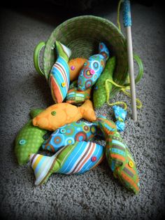 several stuffed animals in a basket on the floor