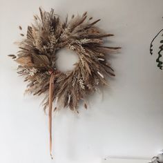 a dried wreath hanging on the wall