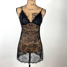 Nwot Victoria’s Secret Black Lace Chemise/Slip Size M Black Lace Lace Up Back Adjustable Straps Measurements Are Approximate: Under Bust Line Side To Side 14” Waist Side To Side 18 From Top Point Of Hemline To Bottom 28.5” Never Worn!! Night Out Camisole Chemise With Built-in Bra, Fitted Sheer Camisole For Night Out, Fitted Slip With Built-in Bra For Night, Black Lace Camisole In Flirty Style, Black Lace Camisole For Night Out, Black Lace Camisole In Feminine Style, Black Delicate Lace Camisole For Night Out, Black Lace Coquette Camisole, Sheer Stretch Camisole For Night Out