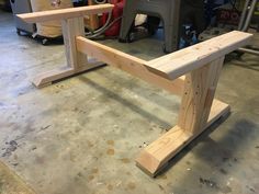 a wooden bench being built in a shop