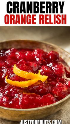 cranberry orange relish in a wooden bowl with an orange peel on top