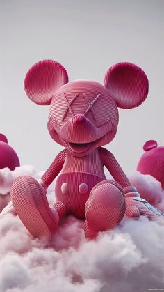 a pink teddy bear sitting on top of clouds