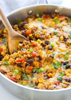 a skillet filled with mexican rice and beans