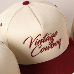 Vintage Cowboy Embroidery Two-Tone Baseball Cap - "Vintage Cowboy" Text Embroidery - 5 Panel Canvas Baseball Cap - 100% Cotton - Adjustable Buckle Closure - Embroidered In USA *One Size Fits All - Adjustable Strap Makes Fit Comfortable.* The VANTAGE Two-Tone Embroidery Trucker Hat blends style and functionality with its distinctive design. The hat features a two-tone color scheme, combining a vibrant or contrasting color on the front panels with a complementary. The embroidered detailing on the Retro Trucker Hat With Embroidered Logo, Vintage White Fitted Hat With Curved Brim, White Vintage Fitted Hat With Curved Brim, Vintage Brown Baseball Cap With Embroidered Logo, Vintage Cotton Snapback Hat With Embroidered Logo, Retro Embroidered Snapback Baseball Cap, Retro Snapback Hat With Embroidered Patch, Vintage Cream Snapback Baseball Cap, Vintage White Snapback Hat With Letter Print