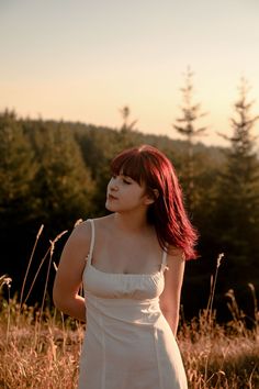 Girl poses and looks to the left in a white dress and the setting sun. Senior Picture Inspiration Fall, Taylor Swift Folklore Photoshoot, Folklore Photoshoot, Outdoor Photoshoot Inspiration, Nature Shoot, Colorful Photoshoot, Folklore Album, K Photo, Photoshoot Senior