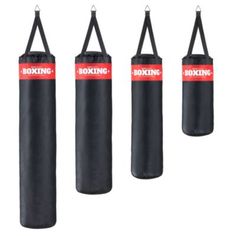 four boxing punching bags hanging from ropes